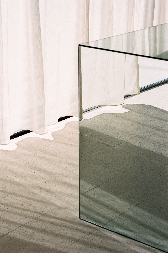 Mirrored pedestal and curtains