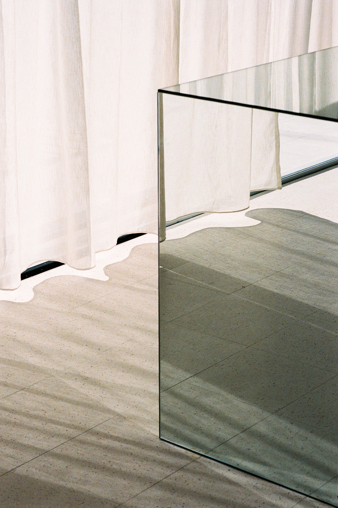 Mirrored cube reflecting curtains